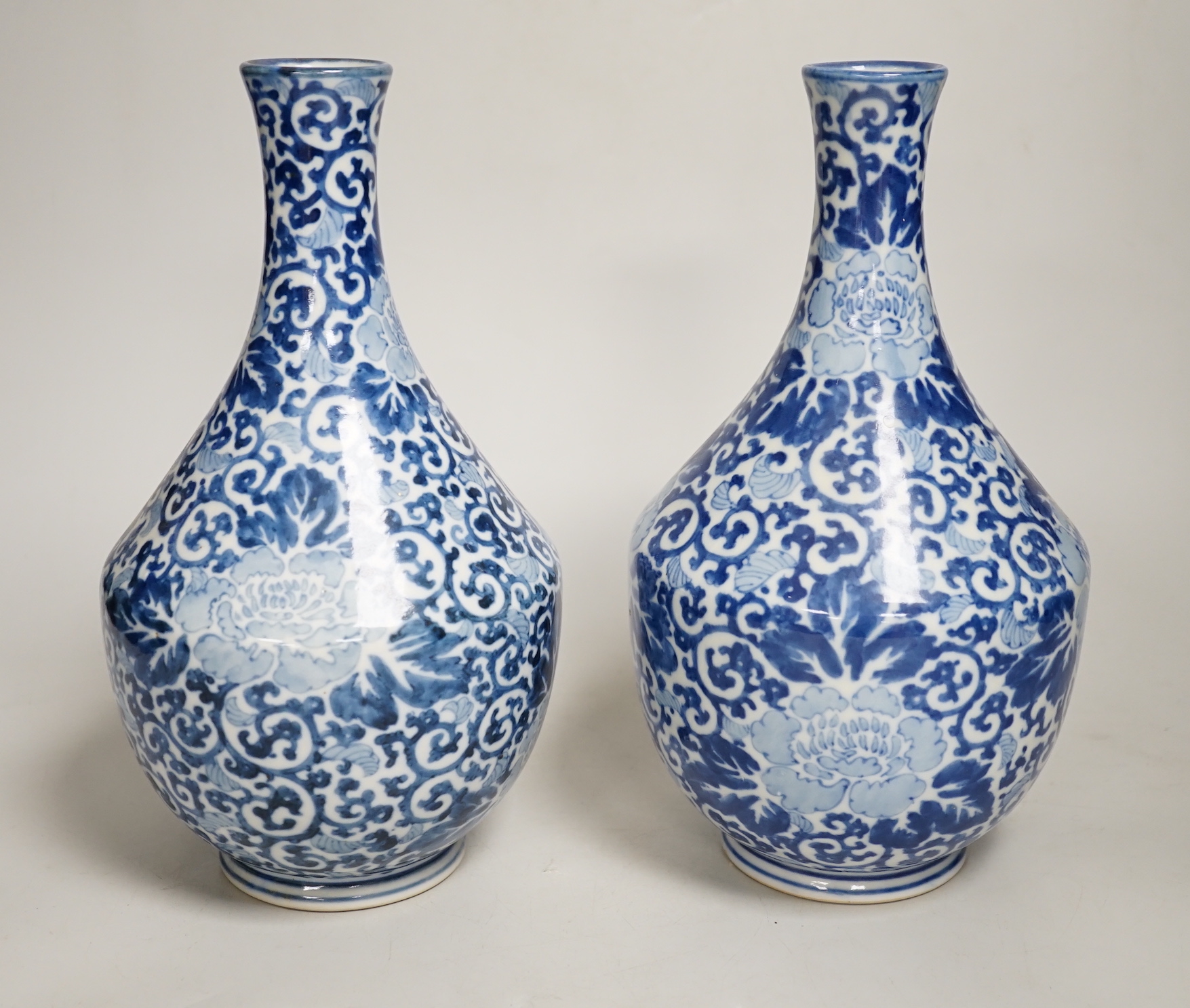 A pair of Chinese blue and white vases, 26cm high